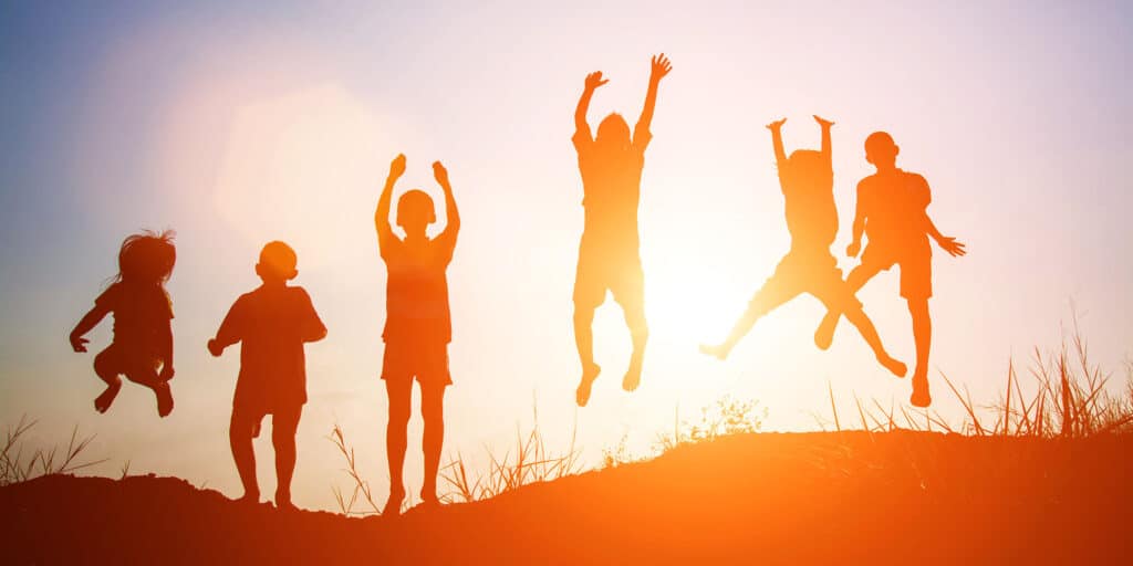 silhouettes of jumping children
