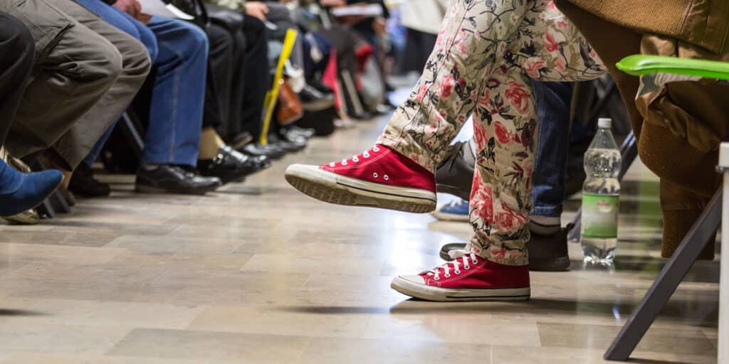 Floor-level view of people in a hospital waiting room